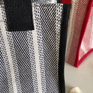 Minimalist canvas tote bag with striped pattern and secure velcro closure for daily use