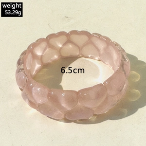 Pink resin heart bangle with water ripple texture, 53.29g weight and 6.5cm diameter size