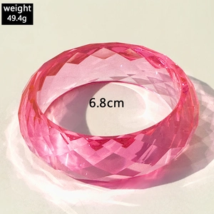 Pink resin bangle with geometric facets weight 49.4g and 6.8cm inner diameter
