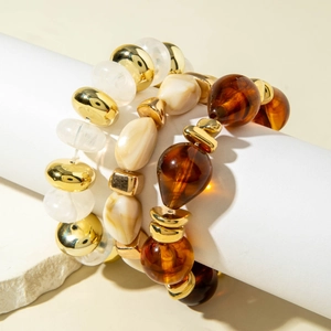 Vintage acrylic beaded bracelet set with gold metallic finish and resin textures