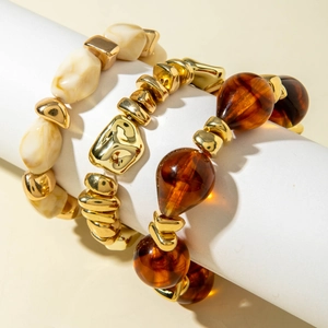 Detailed view of 3-piece vintage acrylic beaded bracelet set with gold metal accents