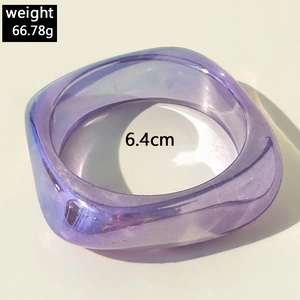 Macro detail of purple iridescent resin bangle with laser aurora finish and square profile