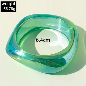 Detail view of iridescent green resin bracelet with 6.4cm diameter and 66.78g weight