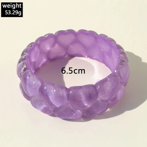 Close-up of translucent purple heart-textured bangle with a 6.5cm diameter and 53.29g weight