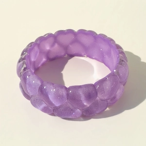 Detailed view of dark purple chunky resin bangle with a unique textured bubble surface