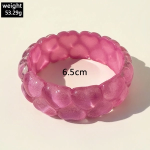Pink heart embossed resin bangle with 53.29g weight and 6.5cm inner diameter detail