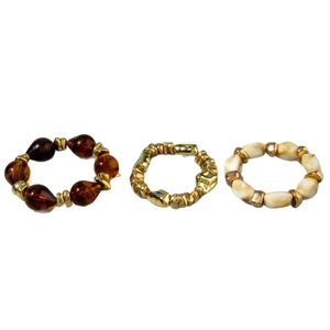 Three-piece layered beaded bracelet set with amber and gold acrylic geometric beads