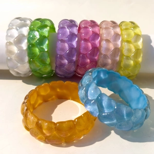 Rainbow macaron glitter heart bangles in various colors with 3D resin embossed texture