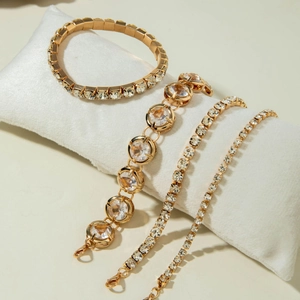 Four-piece gold plated bracelet set featuring CCB square links and luxury rhinestones