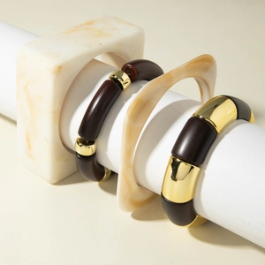 Irregular resin beaded bracelet set with gold metal accents and chunky marble bangles