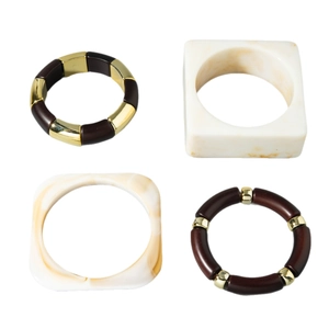 Set of four stylish chunky resin bracelets and beaded bangles with wood grain texture
