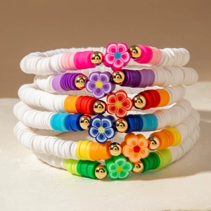Set of 6 bohemian colorful heishi clay bead flower bracelets for a summer vacation look