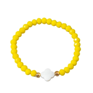 Handmade bracelet featuring faceted yellow crystal beads with a white clover charm