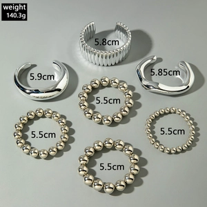 Detail view of 7-piece silver punk bracelet set with weight and inner diameter dimensions