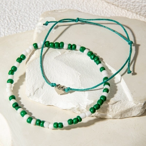 Ensemble de chevillières bohèmes avec perles vertes et blanches et pendentif cœur