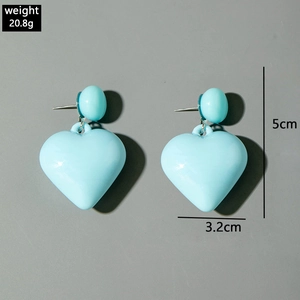 Detail view of light blue heart-shaped drop earrings showing 5cm length and 20.8g weight