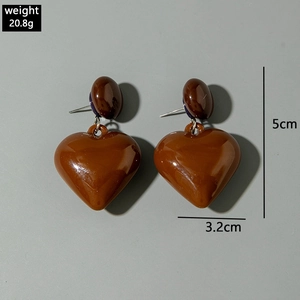Detail view of brown heart pendant earrings with measurements 5cm height and 3.2cm width
