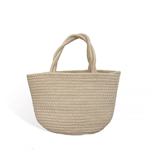 Off-white hand-woven cotton rope bucket bag with handles for beach or kids storage