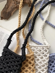 Detailed view of handmade woven cotton rope phone bags in four colors with spiral straps