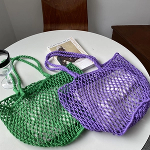 Handmade woven mesh tote bags in green and purple colors for summer shopping