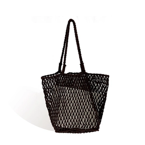 Brown woven hollow knit tote bag with removable white canvas liner for beach vacations