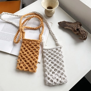 Handmade woven cotton rope crossbody phone bag with hollow mesh design in yellow and beige