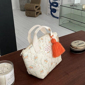 Sac à déjeuner matelassé aux motifs floraux avec un gland orange et double poignée