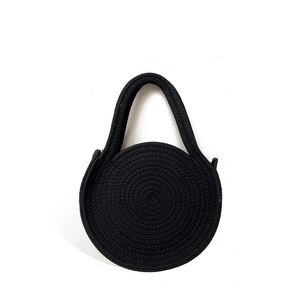 Handcrafted black round woven cotton rope bag with spiral texture for summer beach vacation