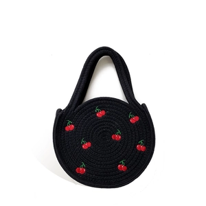 Handmade black woven rope tote bag featuring cherry embroidery and stylish round handle