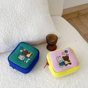 Close-up of cute cartoon embroidery on square mini canvas storage bags with zippers