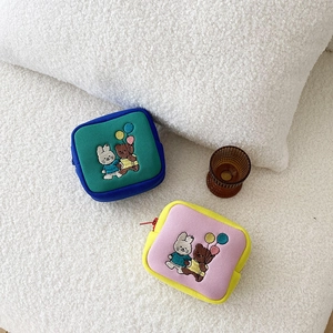 Close-up of cute cartoon bear and bunny embroidery on colorful mini square zipper pouches