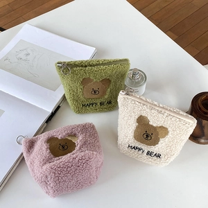 Three plush teddy bear makeup bags in pastel colors with soft lamb wool texture