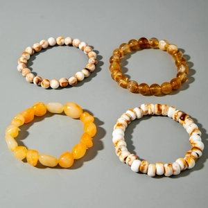 Detailed view of bohemian multilayer acrylic beaded bracelets with various marble textures