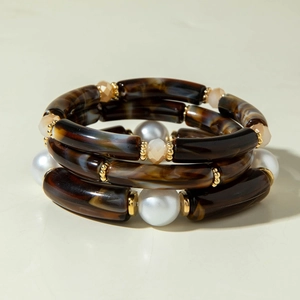 Three-piece layered bracelet set with tortoiseshell tubes, pearls and gold accent beads