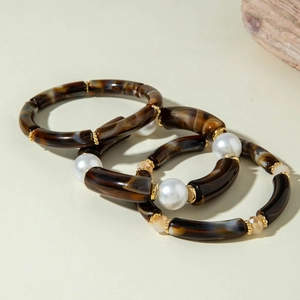 Set of three Bohemian style acrylic bangles with tortoise shell pattern and pearls