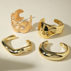 Set of four punk style gold geometric hollow cuffs and smooth bangles for women