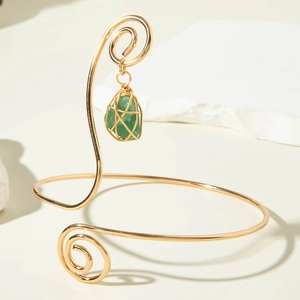 Adjustable spiral metal arm cuff with green raw stone pendant in bohemian style