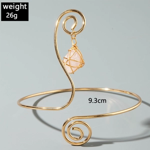 Bohemian gold metal arm cuff detail with pink gemstone pendant and size dimensions