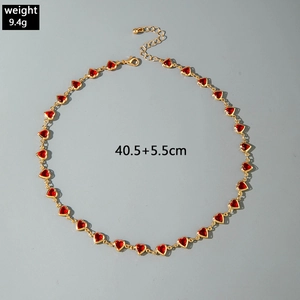Detail of red heart link necklace with lobster clasp and adjustable extension chain