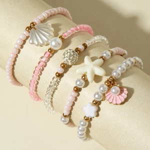 Ensemble de bracelets en perles roses thème océan avec breloques coquillage et étoile