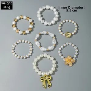 Detailed set of 7 pearl bead bracelets with gold charms and 5.5cm inner diameter