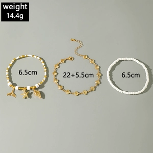 Detailed view of bohemian anklet set with starfish, shell charms and beaded layers