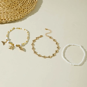 Bohemian beach anklet set with starfish shell charms and gold woven beads for summer vacations