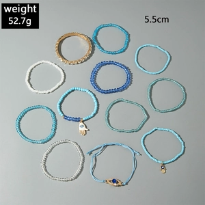 Detail view of 11pcs bohemian evil eye beaded bracelets set featuring Hamsa hand charms