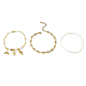Bohemian beach anklet set with starfish, seashell, and whale tail charms in gold and white