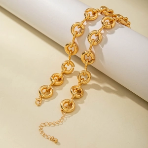 Close-up of golden chunky link necklace with lobster clasp and adjustable extension chain