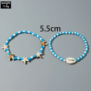 Bohemian blue and white beaded anklet set with starfish and natural shell charms