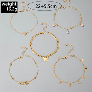 Detailed set of 5 gold-toned butterfly and heart layered anklets showing 22+5.5cm length