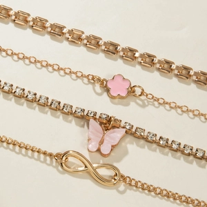 Detail of 4pcs gold layered bracelets with pink butterfly, flower and infinity charms