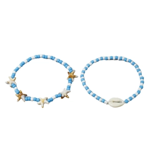 Blue and white beaded anklet set with starfish charms and a natural seashell for summer